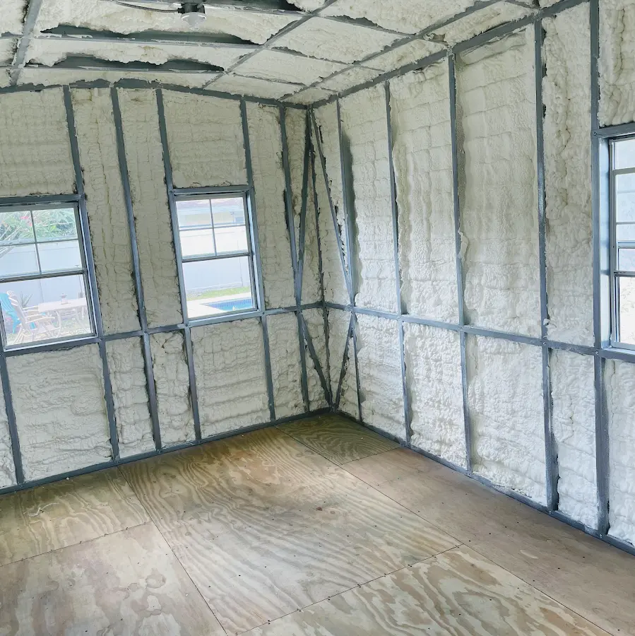 Closed-cell spray foam insulation applied to wall cavities in a residential project in Essex Junction